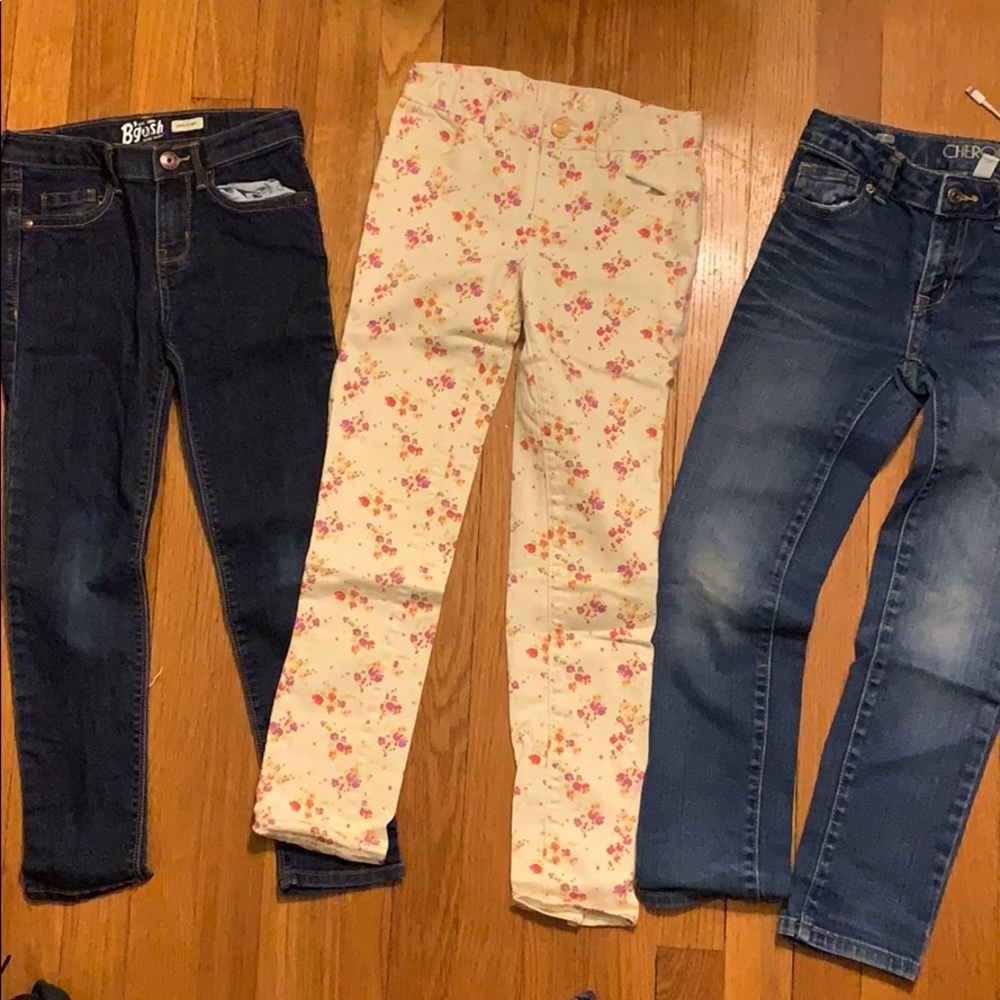 Size 7 skinny jeans; one floral, two blue denim